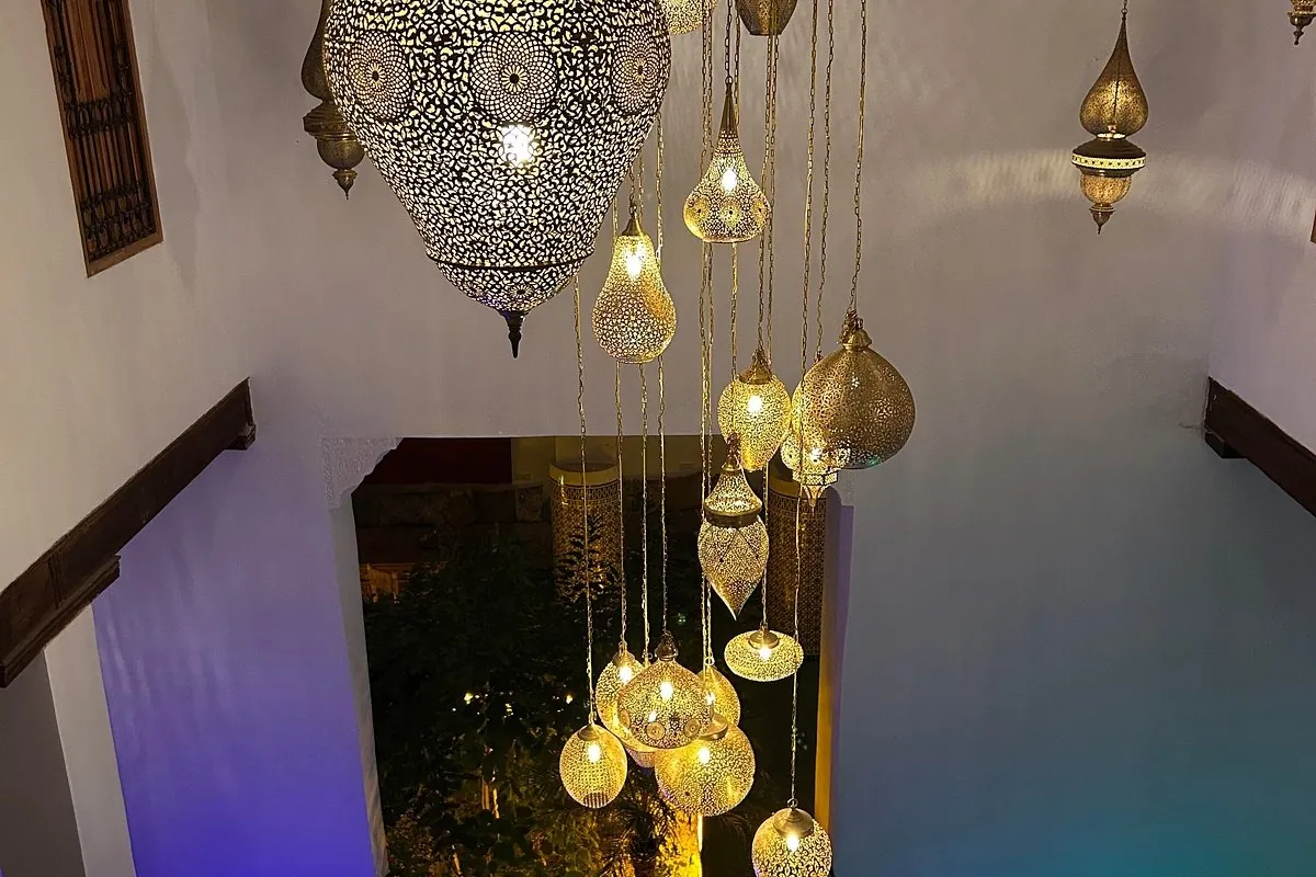 Handcrafted brass lanterns suspended in the riad