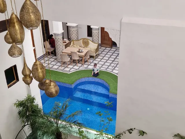 Looking down on the courtyard pool and hanging brass lanterns