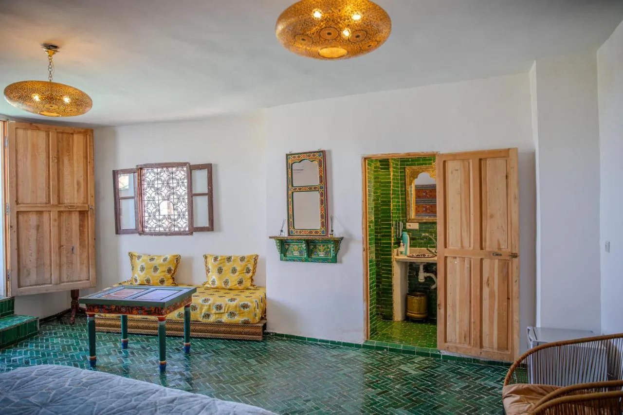 Quiet riad lounge with traditional craft details