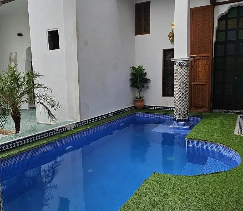 Daylight view of the riad courtyard pool
